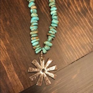 Hand engraved spur rowl on turquoise necklace